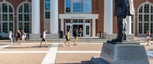 Centre students walking to class passing the library